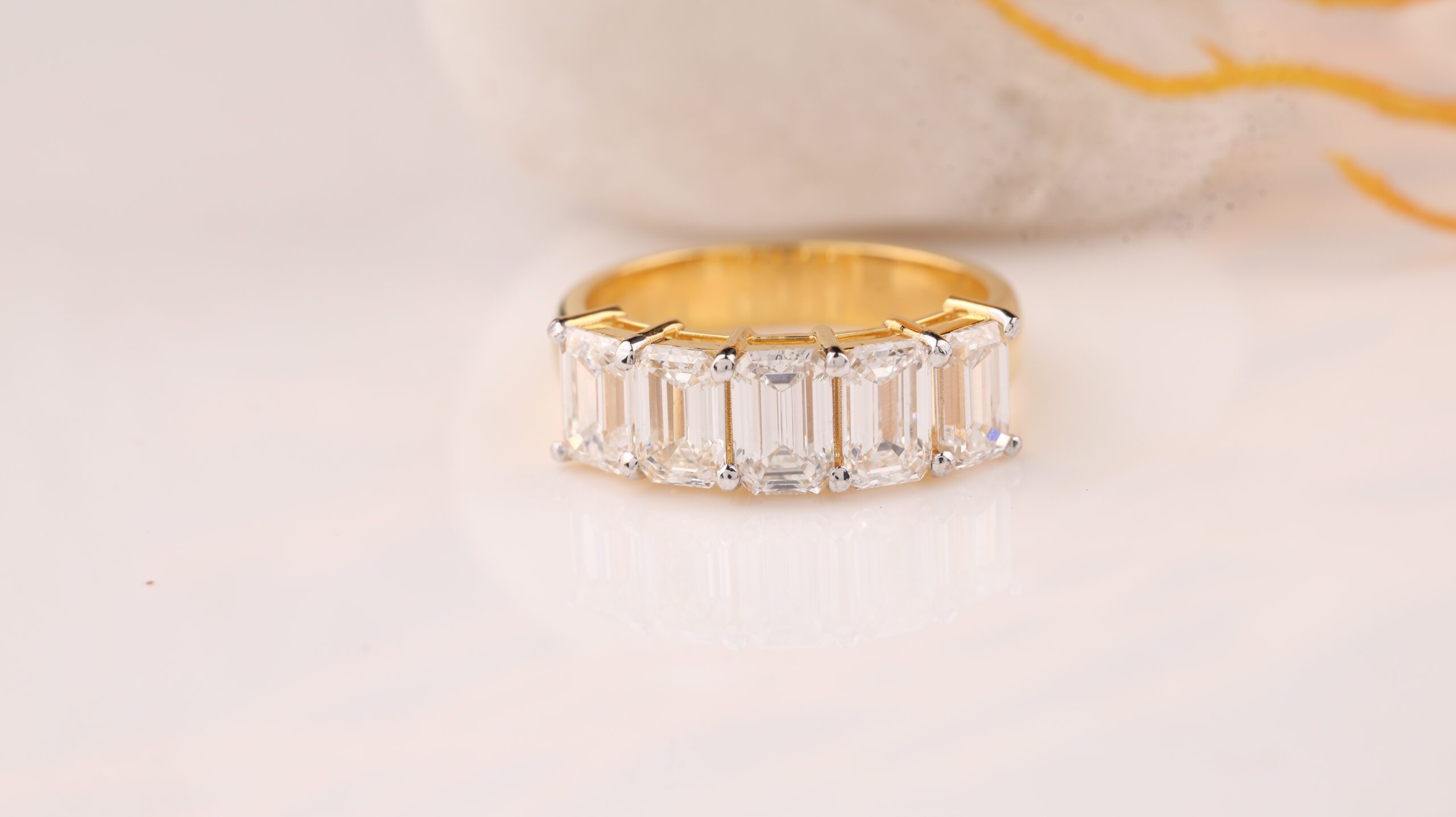 FIVE-STONE EMERALD RING