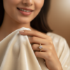 Woman holding ring with elegance.